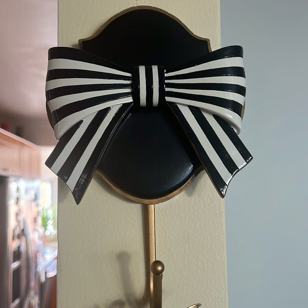 Pretty as a bow! Wall hook 7 in wide and 10 in long from the tip to the hook